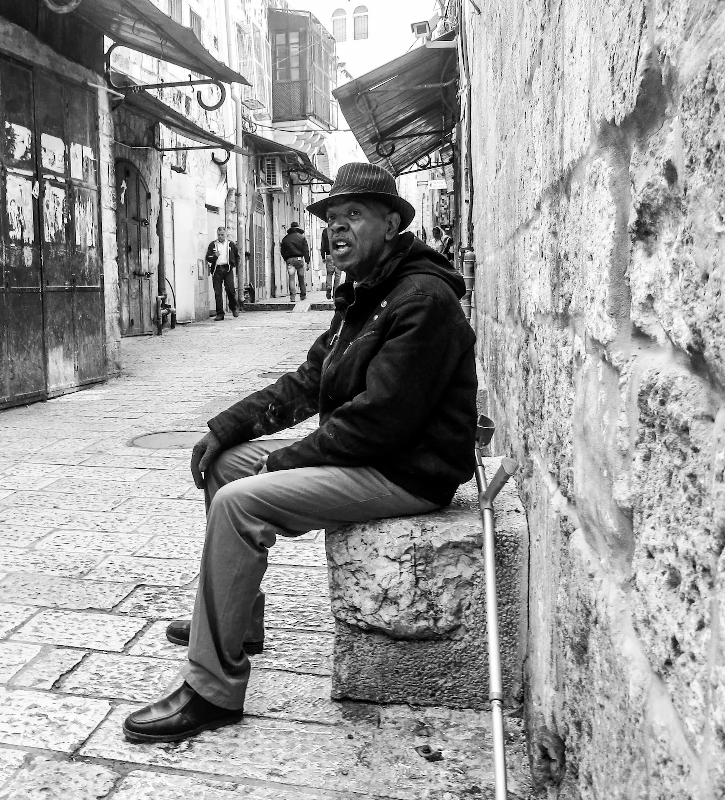 Ali sitting in an alley in the Muslim Quarter, Old City Jerusalem