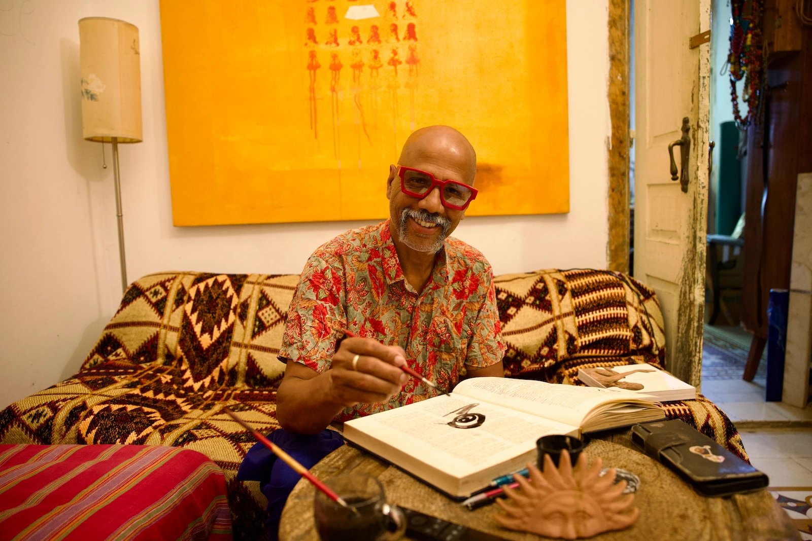 Painter Chanchal Banga sketching in his Jaffa home
