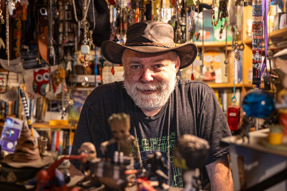 Eli the bookshop owner behind his counter in Jerusalem