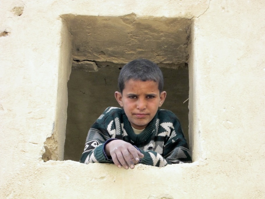 Bedouin boy at the window, Rashayda camp, Judean Desert