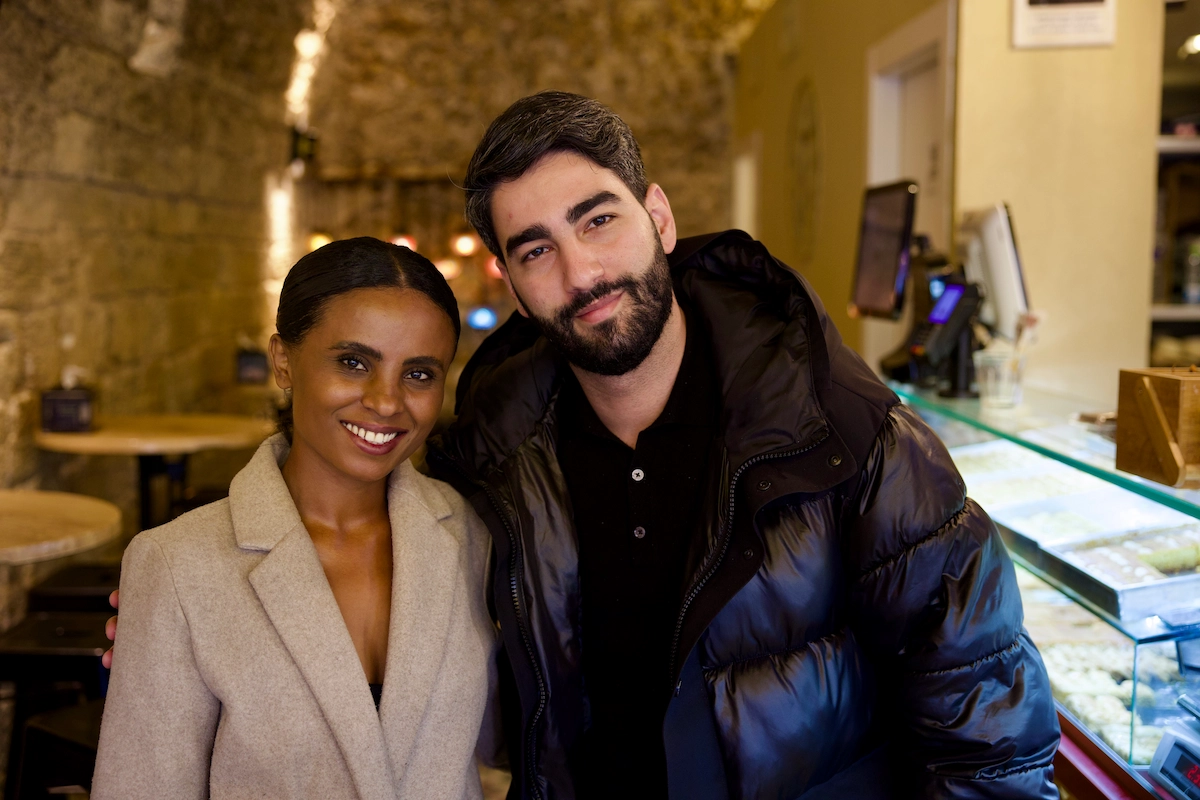 Couple in a stone-vaulted café in old Jaffa