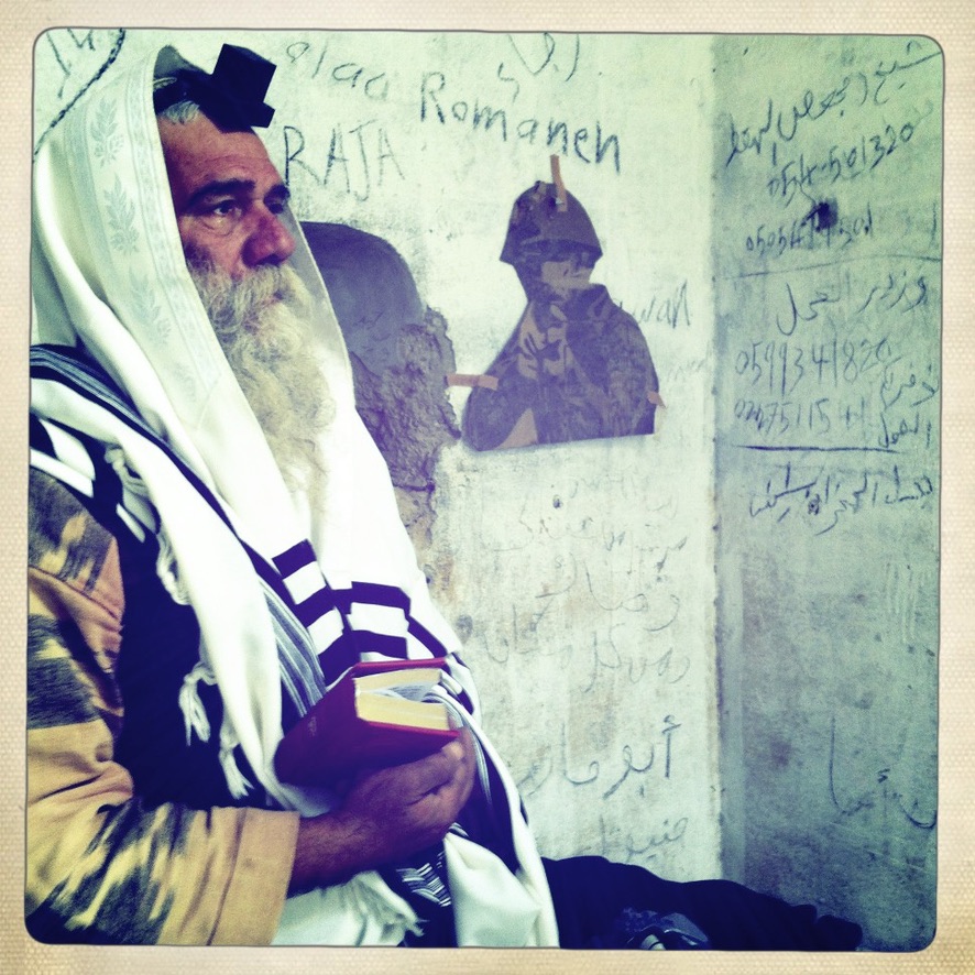 Oran praying at abandoned Jordanian fort