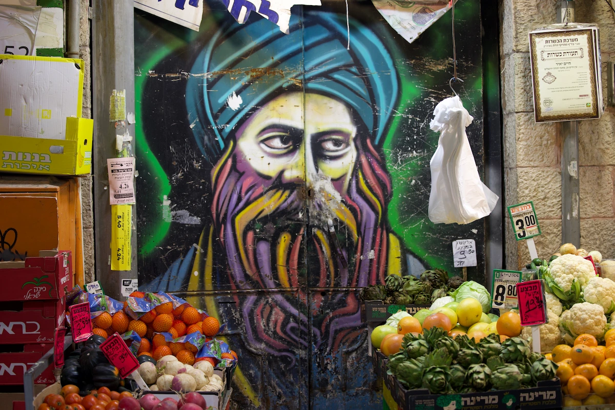 Graffiti face on market shutter at Mahane Yehuda Jerusalem