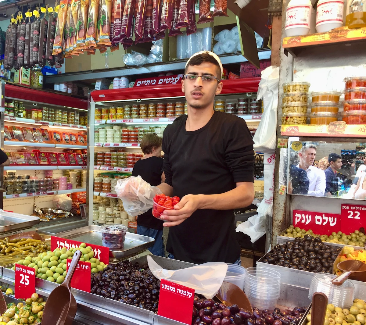 Olive vendor at Mahane Yehuda market, Jerusalem